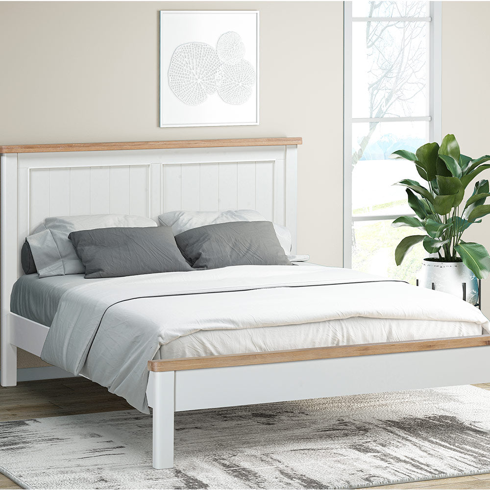 Painted off-white bedframe with natural wood accents