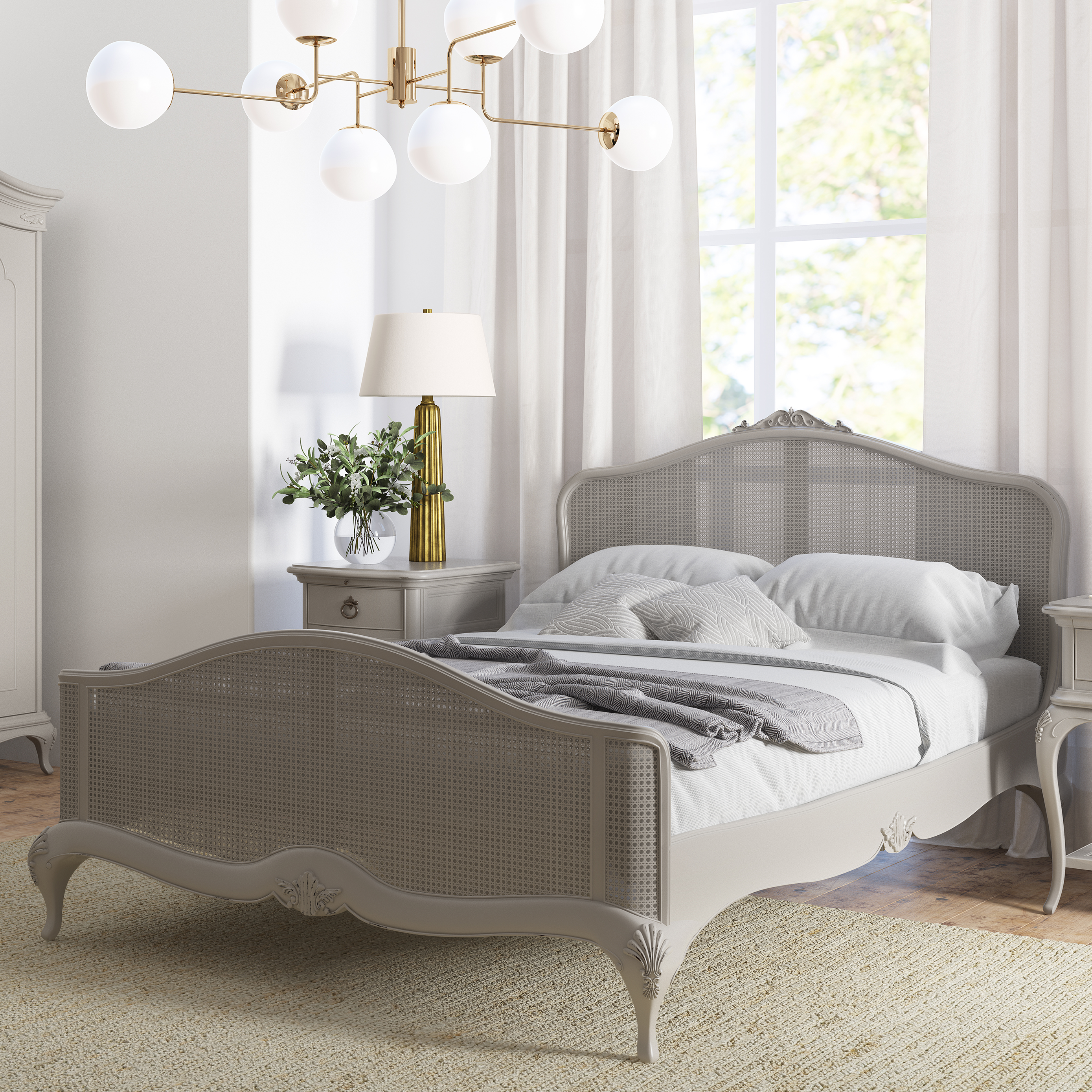 Chic grey rattan bedstead with intricate headboard and footend