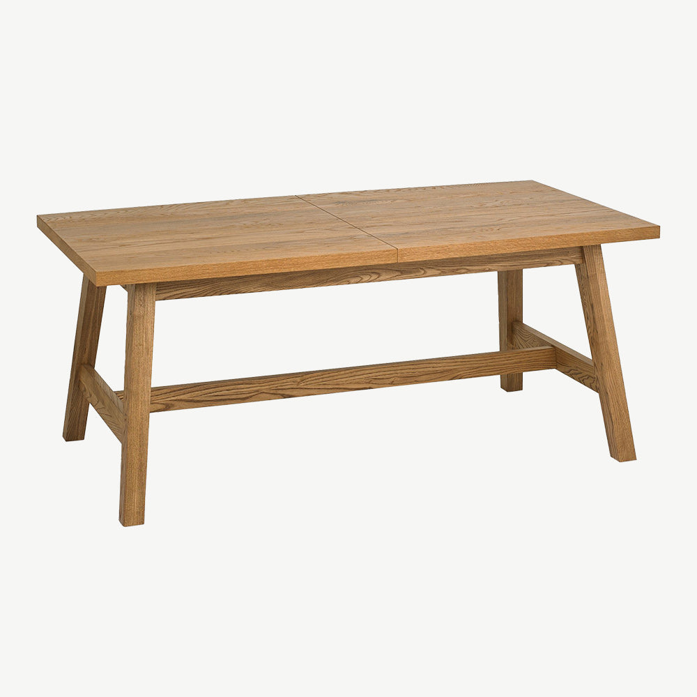 Rustic oak extending dining table with laminated oak tabletops and solid ash legs all in natural finish
