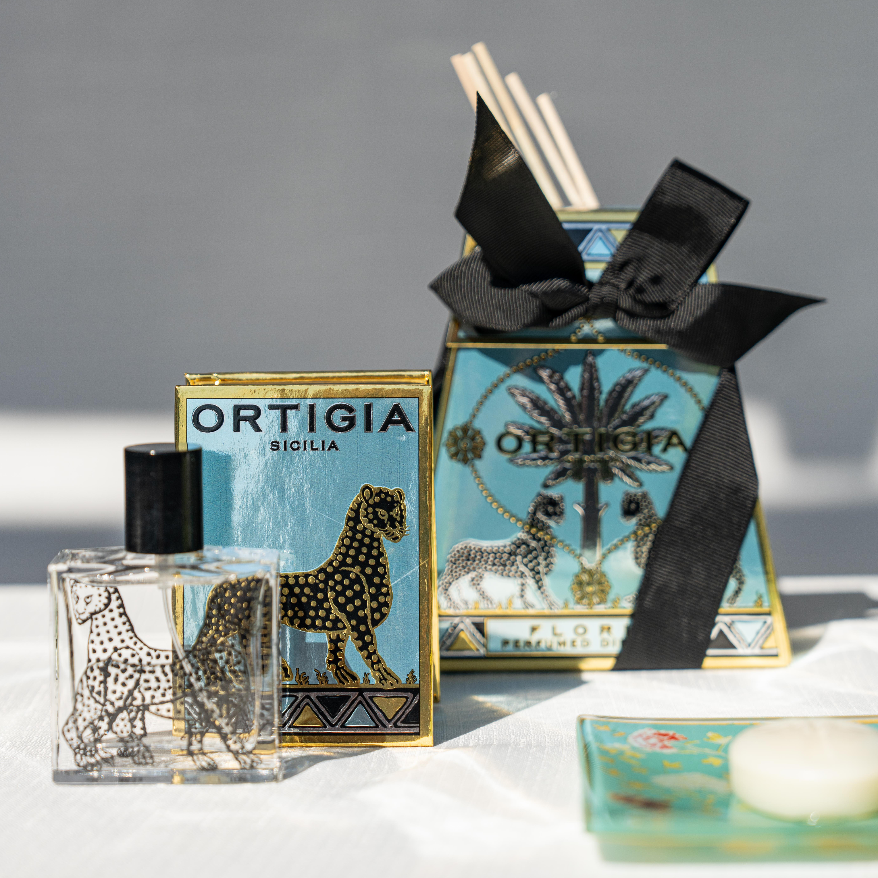 Ortigia Florio Diffuser in signature glass bottle with accompanying natural diffuser reeds
