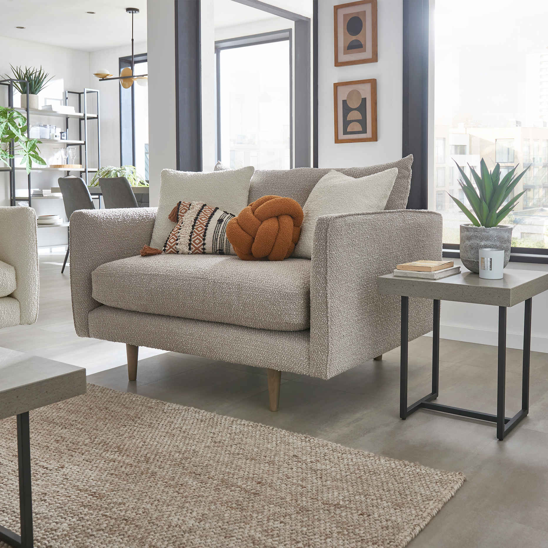 Modern snuggler chair in monza mink boucle fabric