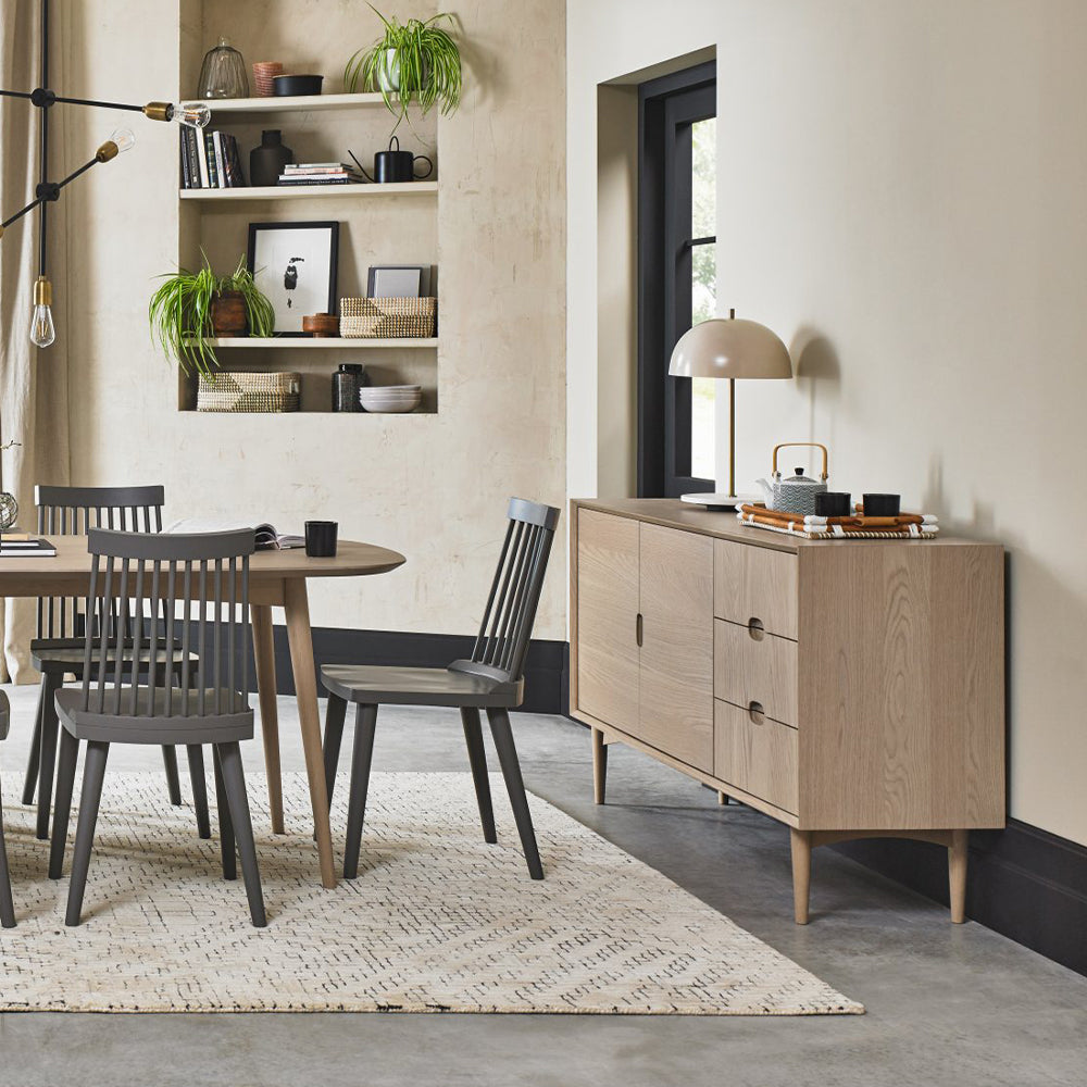 Oak veneer wide sideboard with solid beech legs in light oak finish