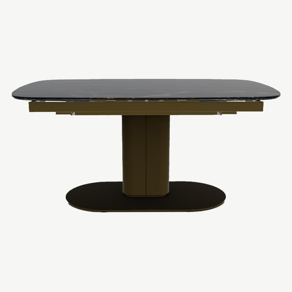 Black marble top extending dining table with matt bronze frame and floor plate