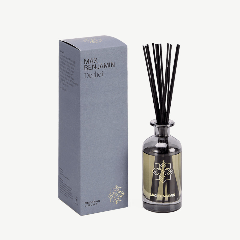 Scented diffuser in smoked glass with matching diffuser sticks