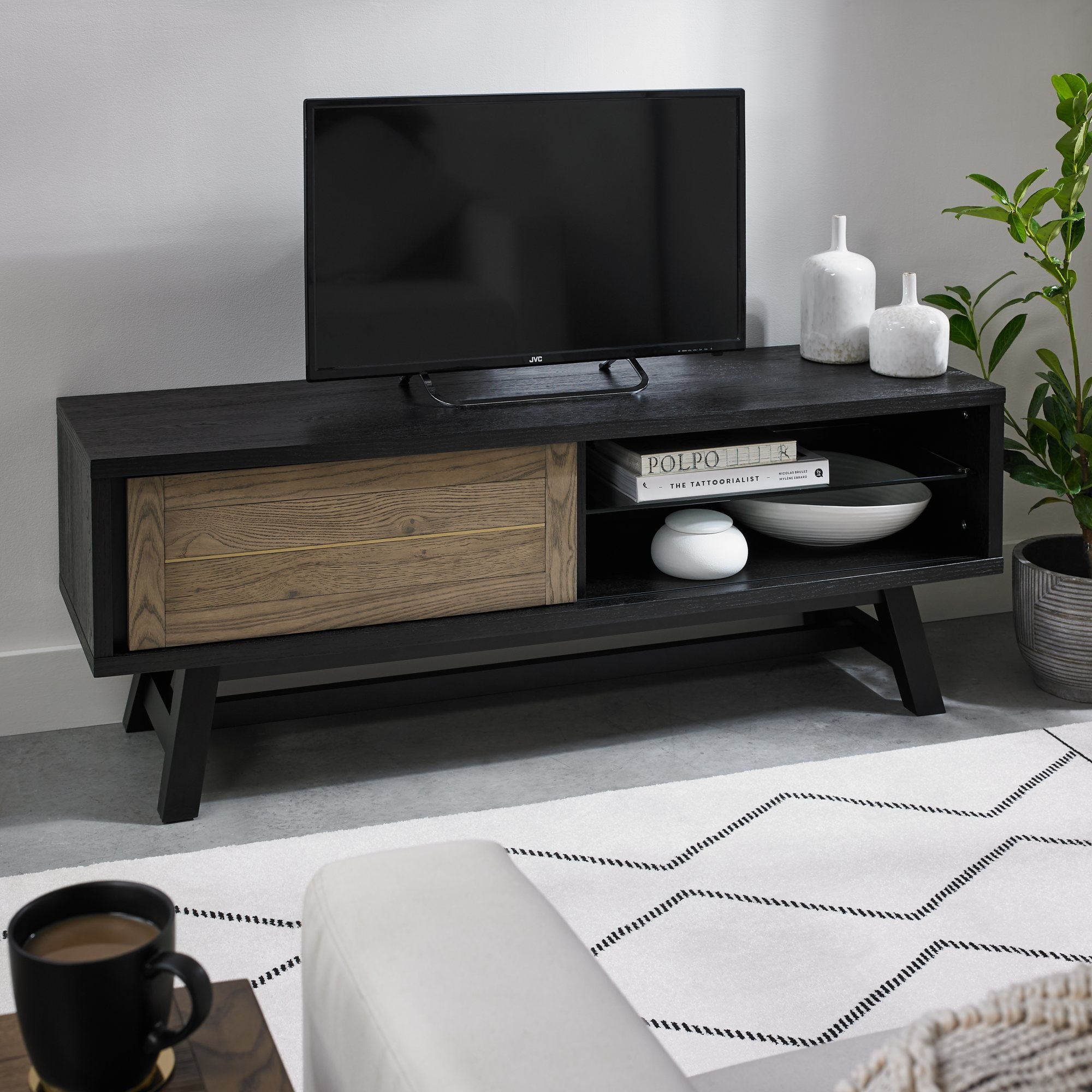Oak veneer entertainment unit with black peppercorn base