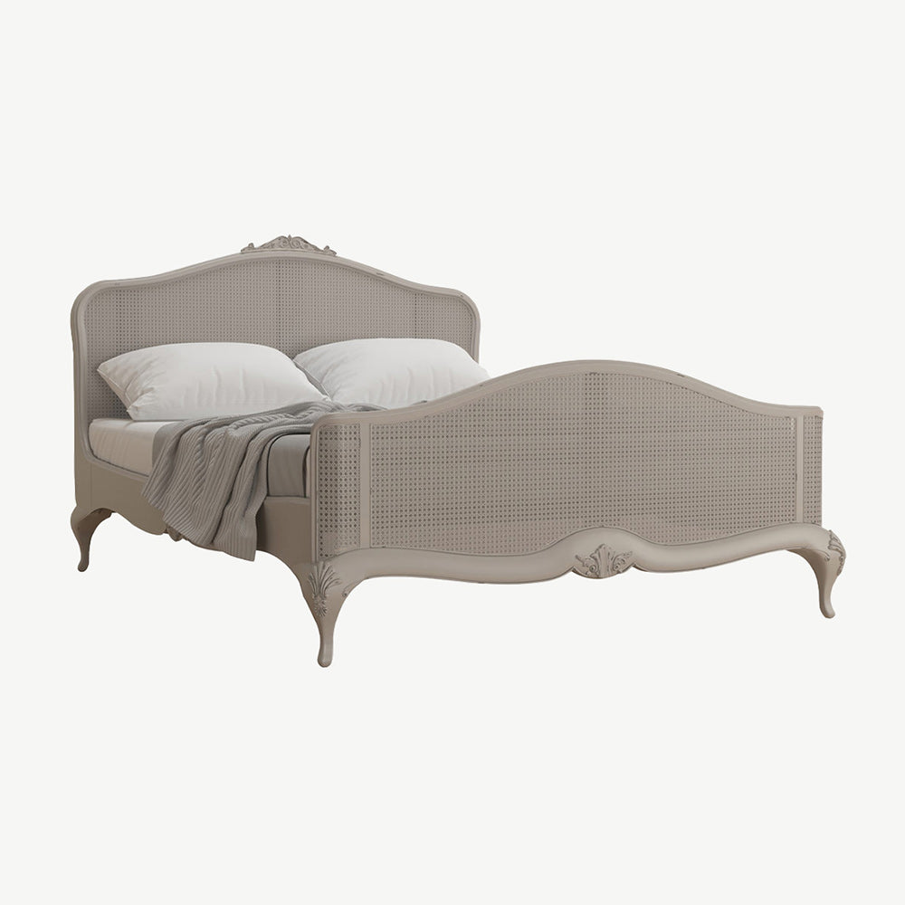 Chic grey rattan bedstead with intricate headboard and footend