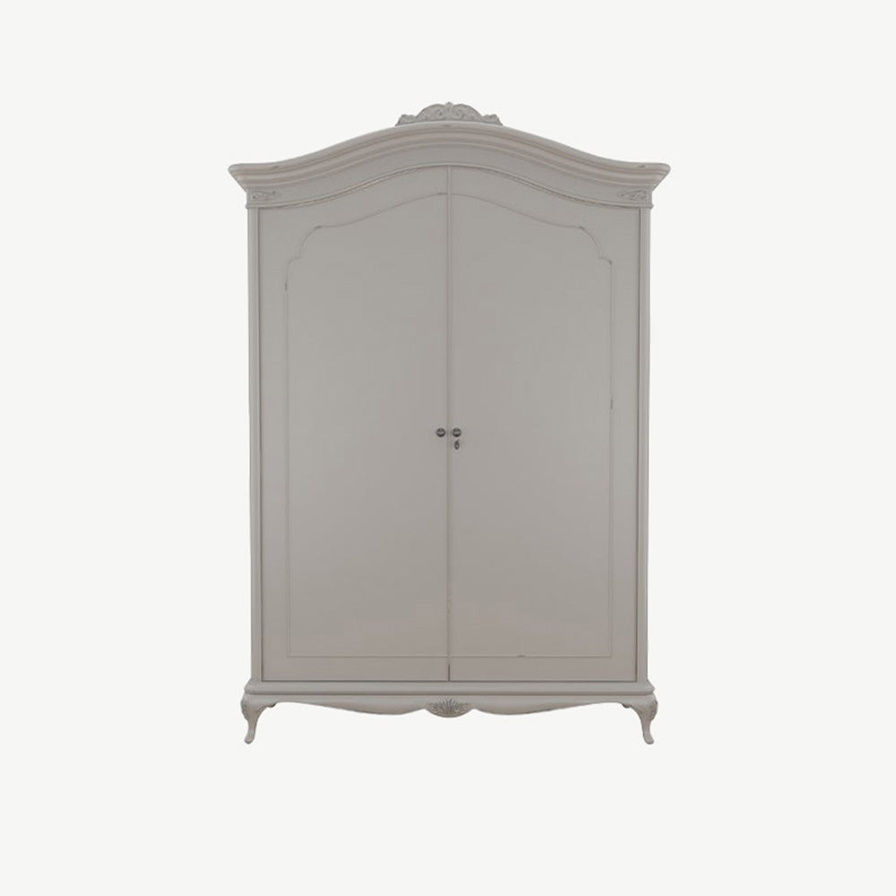 A closed soft grey wardrobe with curved top and ornate crown, featuring double doors and decorative legs