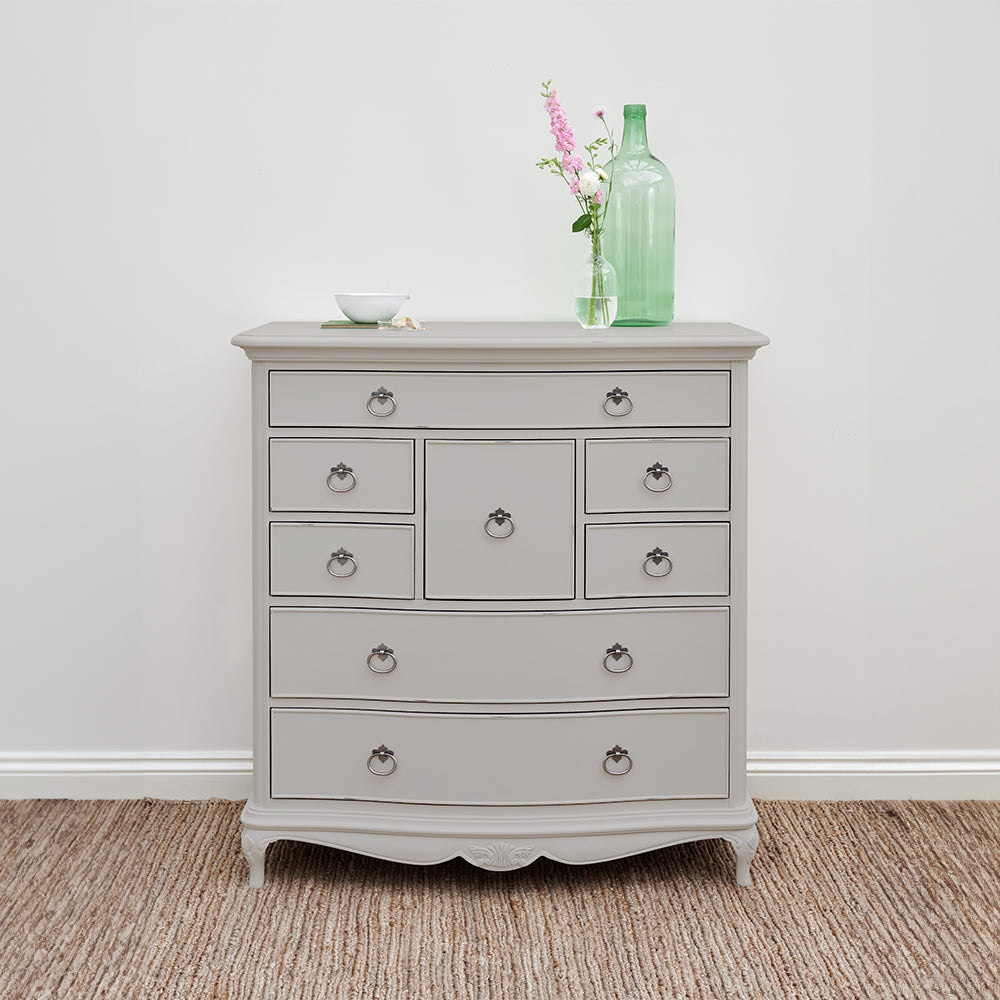 Grey dresser with decorative vase on top