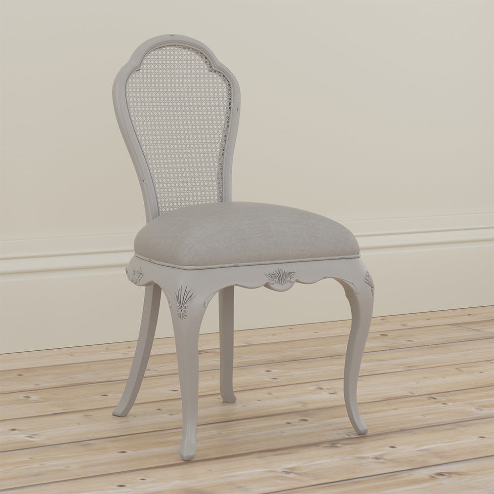 Grey upholstered chair with a cushioned seat and backrest