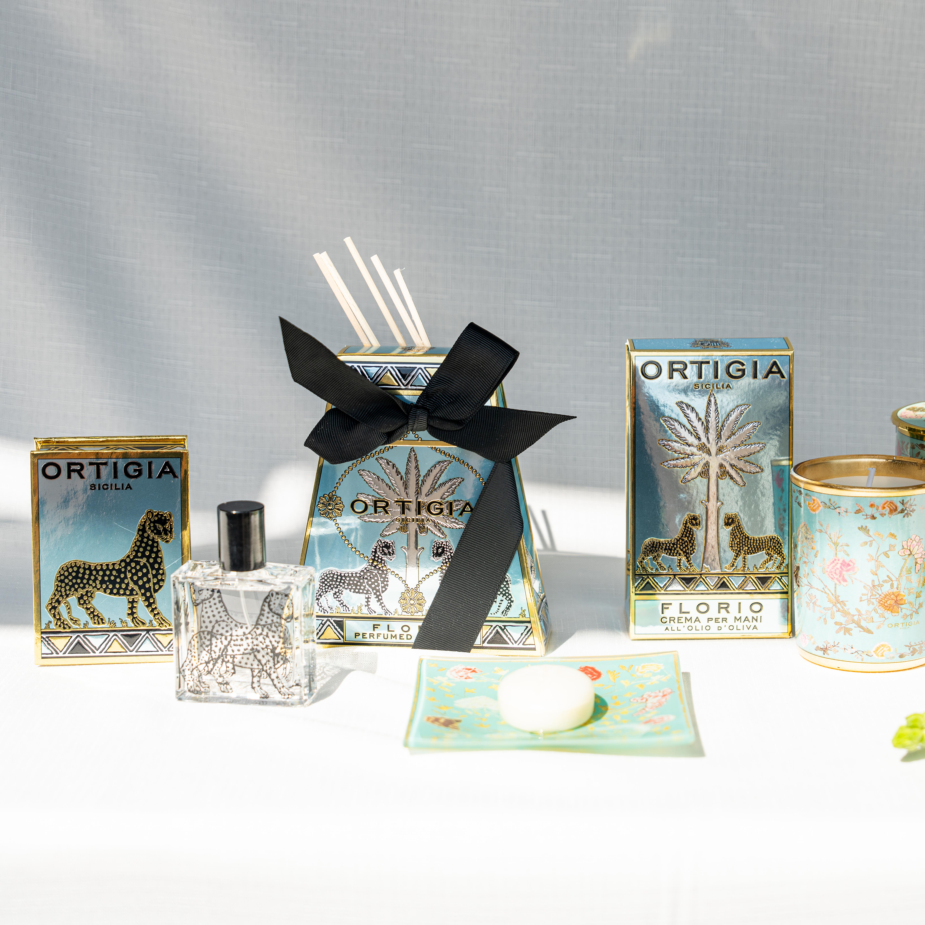 Ortigia Florio Diffuser in signature glass bottle with accompanying natural diffuser reeds