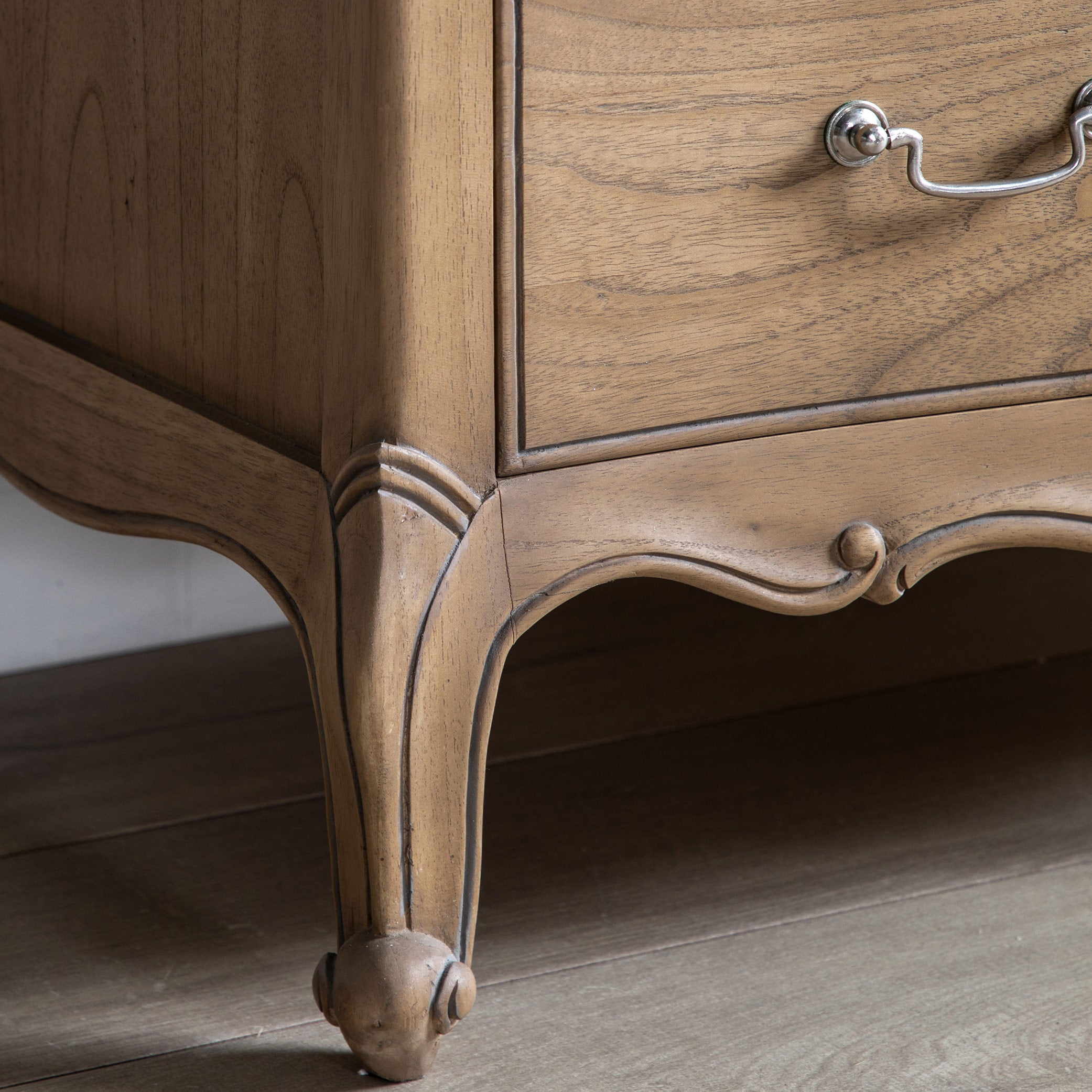 Mindy ash 5 drawer chest in weathered finish featuring dovetailed joints and hand carved sections