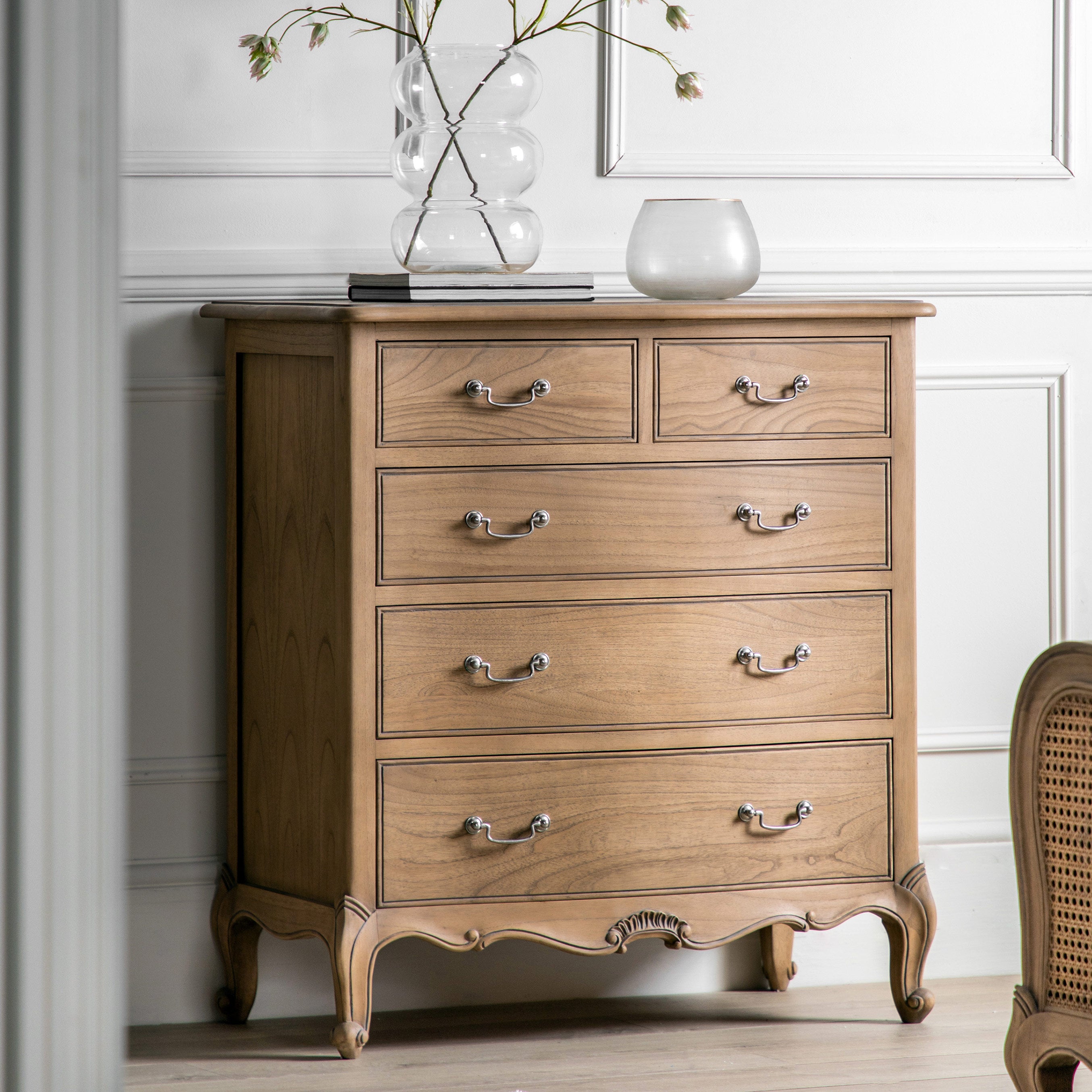 Mindy ash 5 drawer chest in weathered finish featuring dovetailed joints and hand carved sections