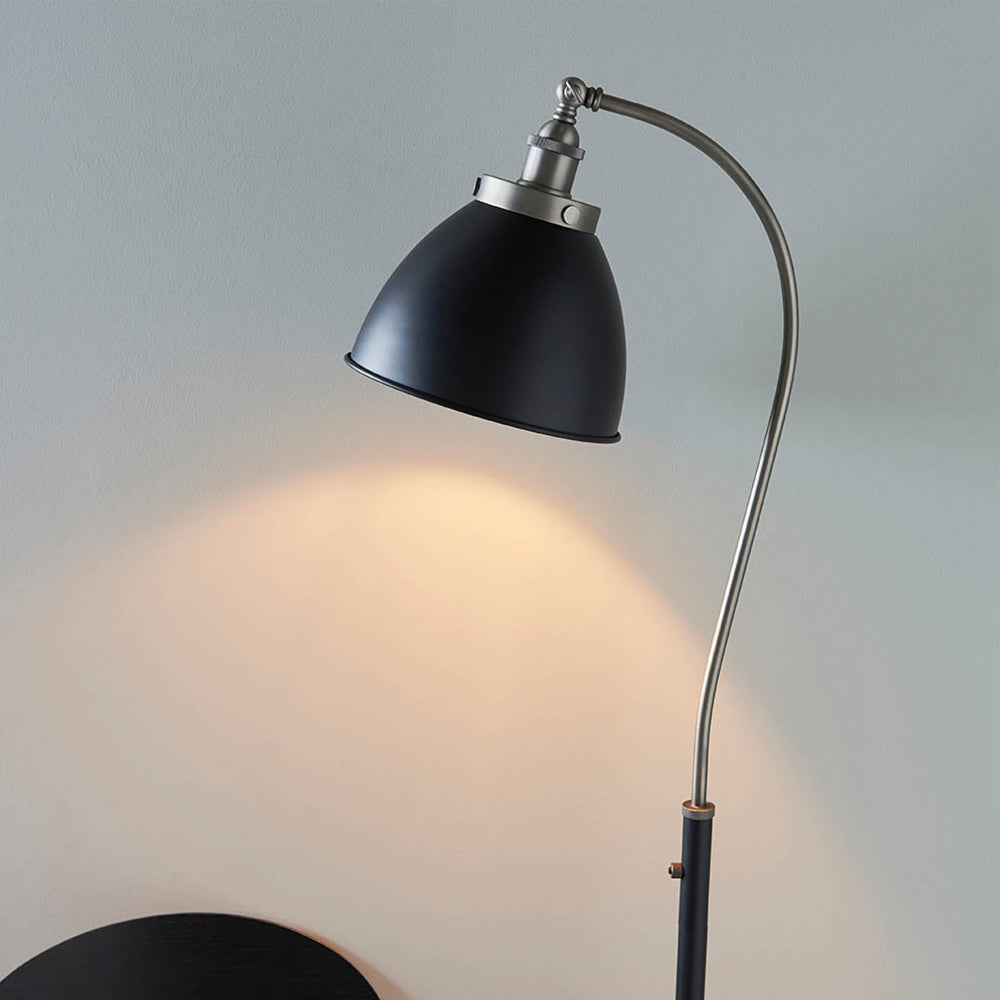 Authentic resto style adjustable floor light, finished in matt black paint with aged pewter plated details