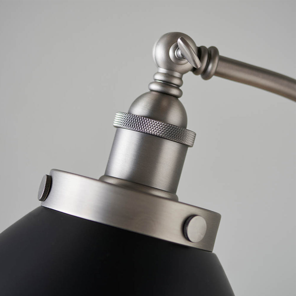 Authentic resto style adjustable floor light, finished in matt black paint with aged pewter plated details