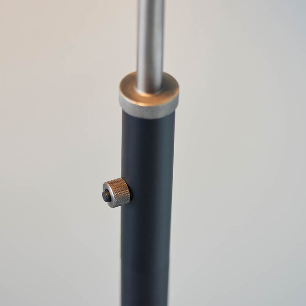 Authentic resto style adjustable floor light, finished in matt black paint with aged pewter plated details