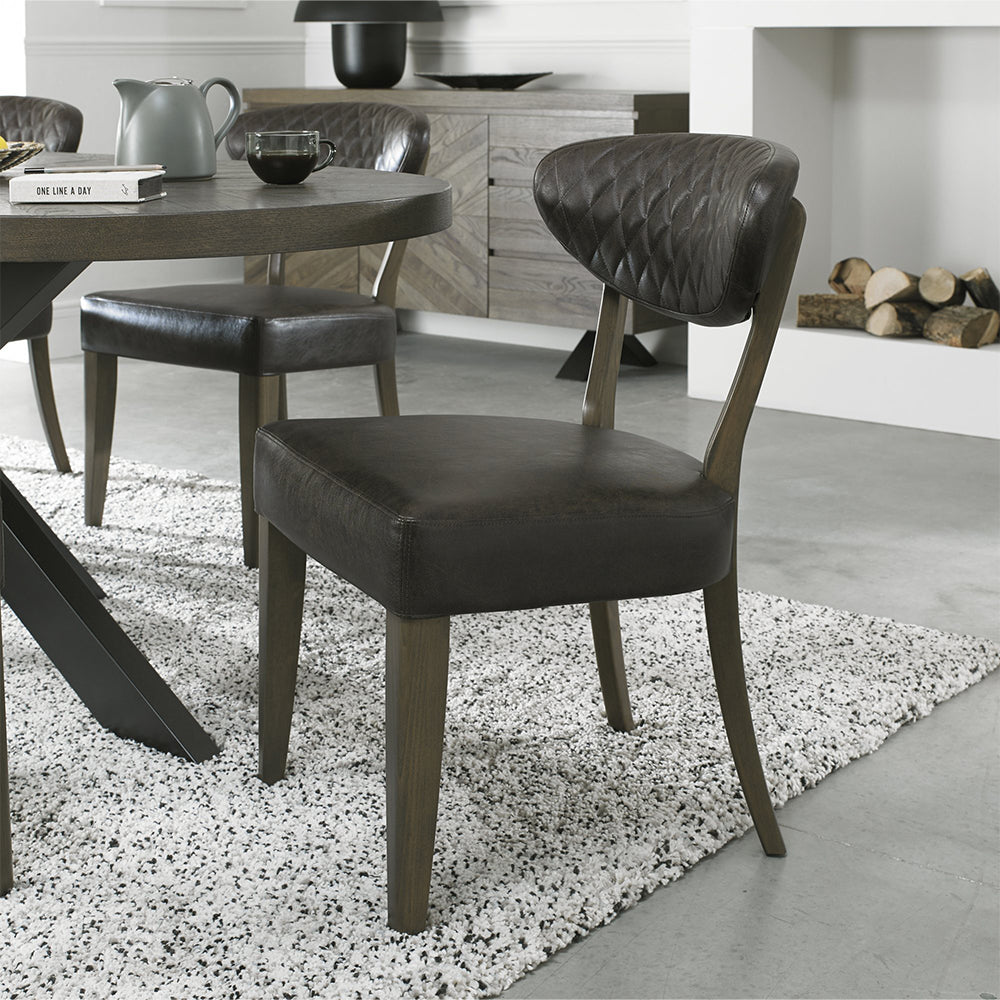 Solid oak chair uphosltered in dark faux leather