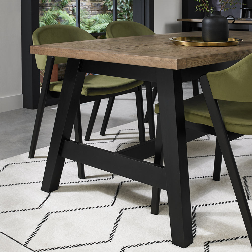 Oak veneer extending dining table with black peppercorn solid ash legs