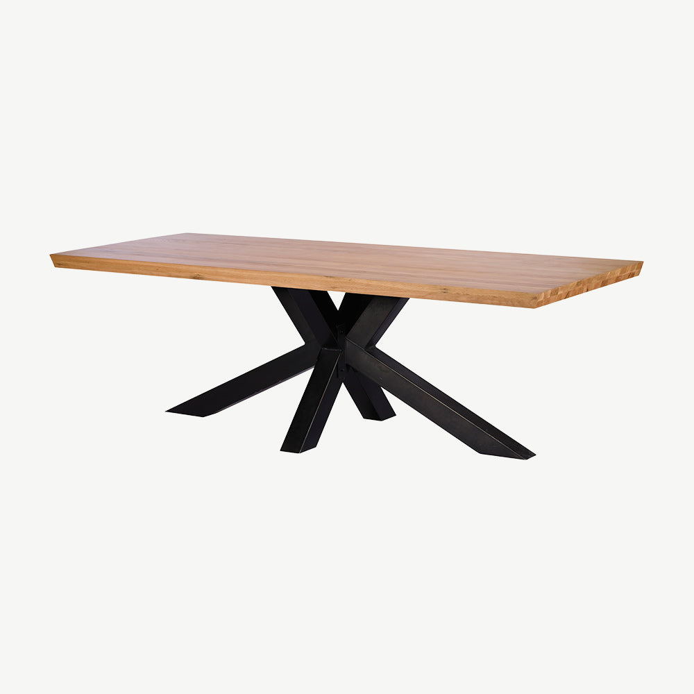 Dining table with natural wooden top and star design black metal base