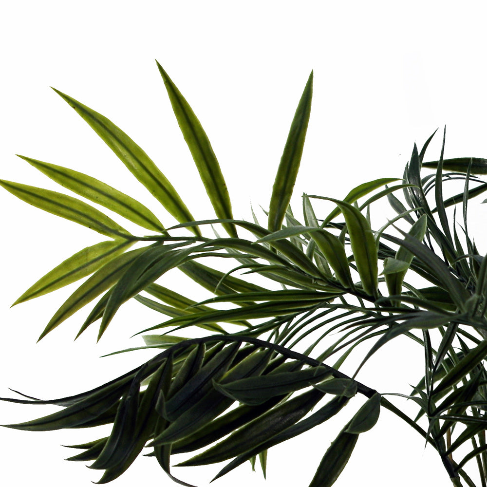 Artificial mini palm in neutral pot