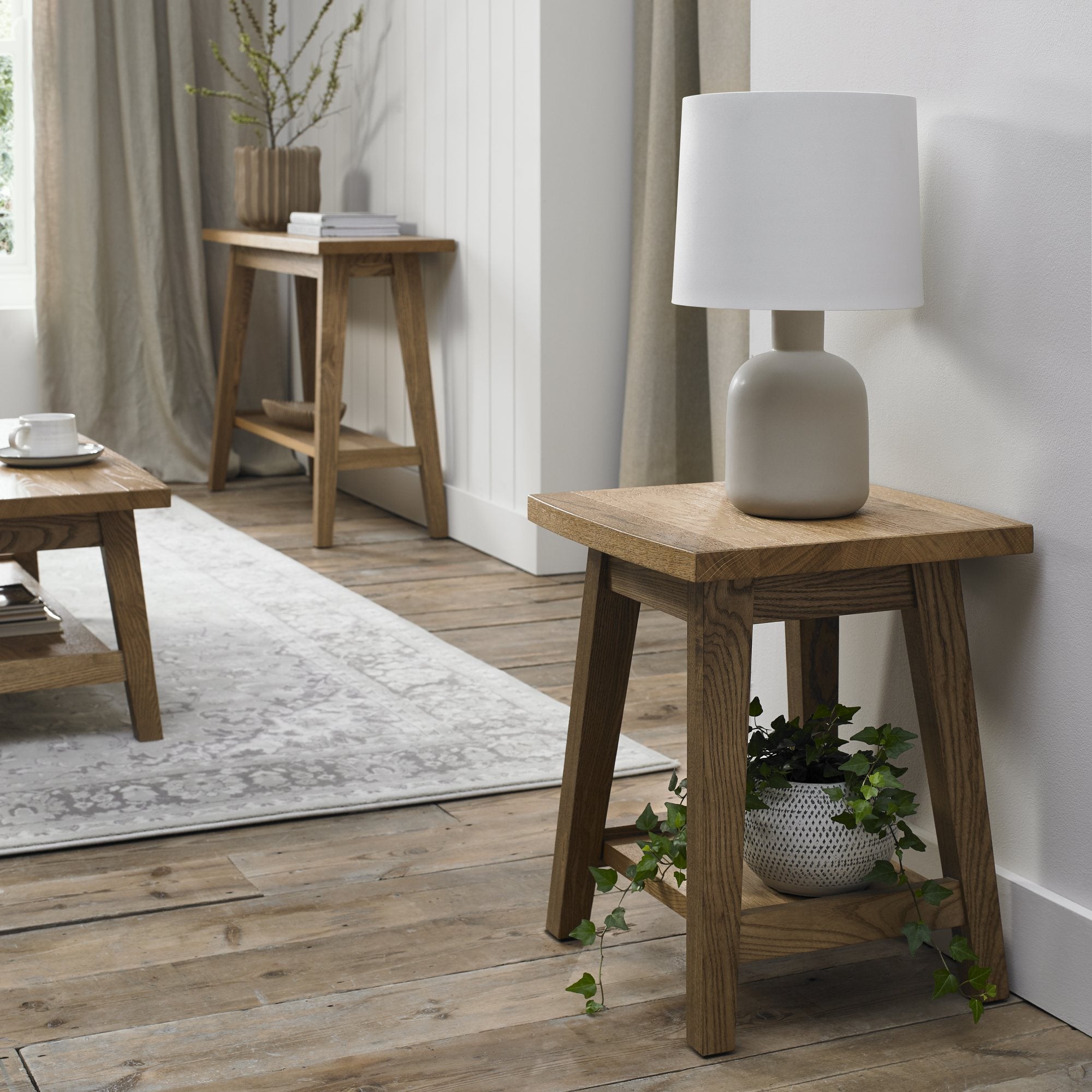 Rustic oak lamp table with laminated oak top and solid ash legs all in natural finish