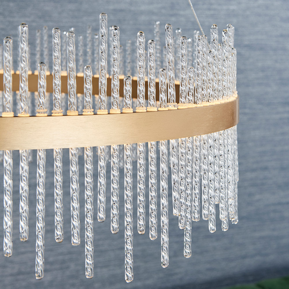 Brushed gold plated pendant with twisted clear glass rods
