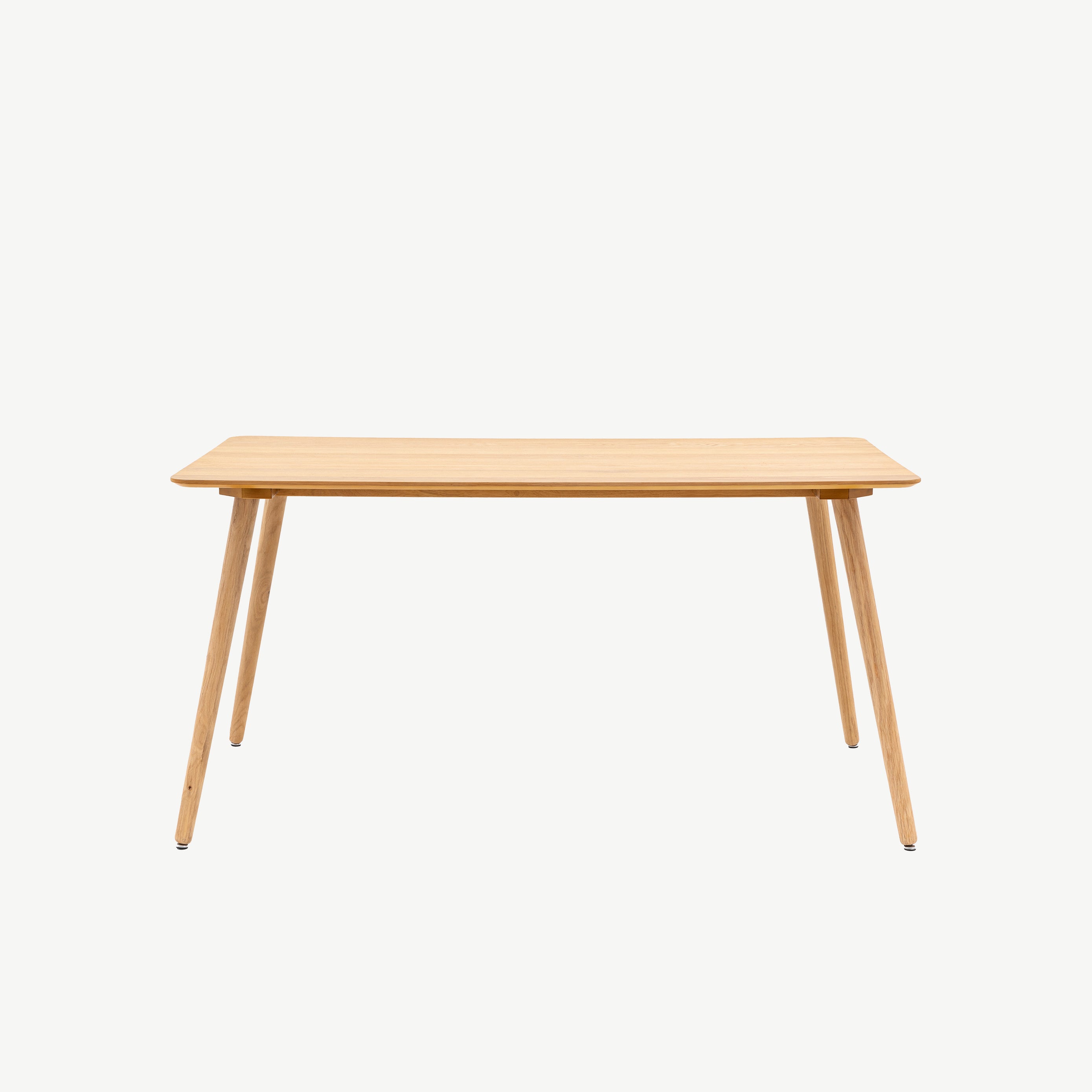 Rectangular wooden dining table in natural oak finish