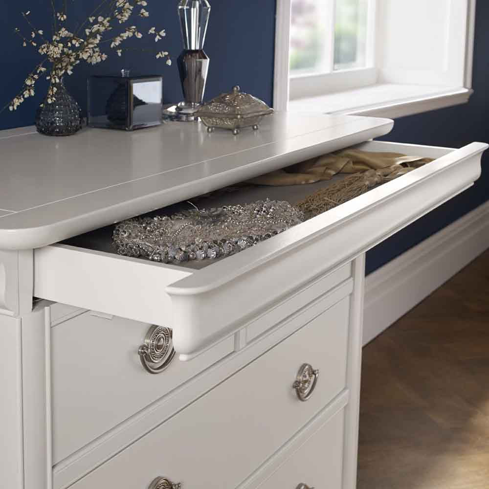 Wooden 2 and 2 drawer chest in painted white finish with silver handles