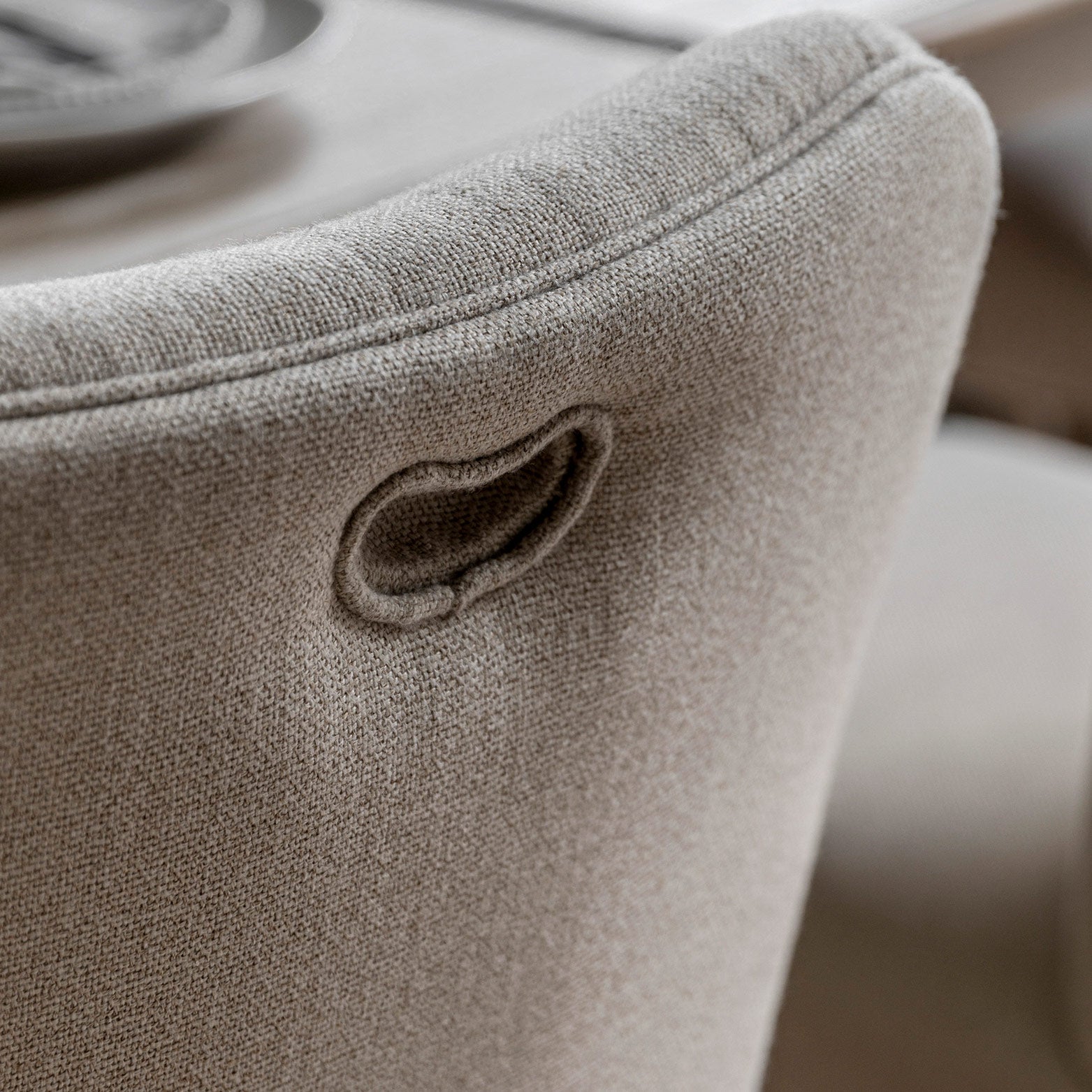 Oak dining chair in lime wash finish, handrafted bobbing detailed legs and upholstered neutral fabric seat