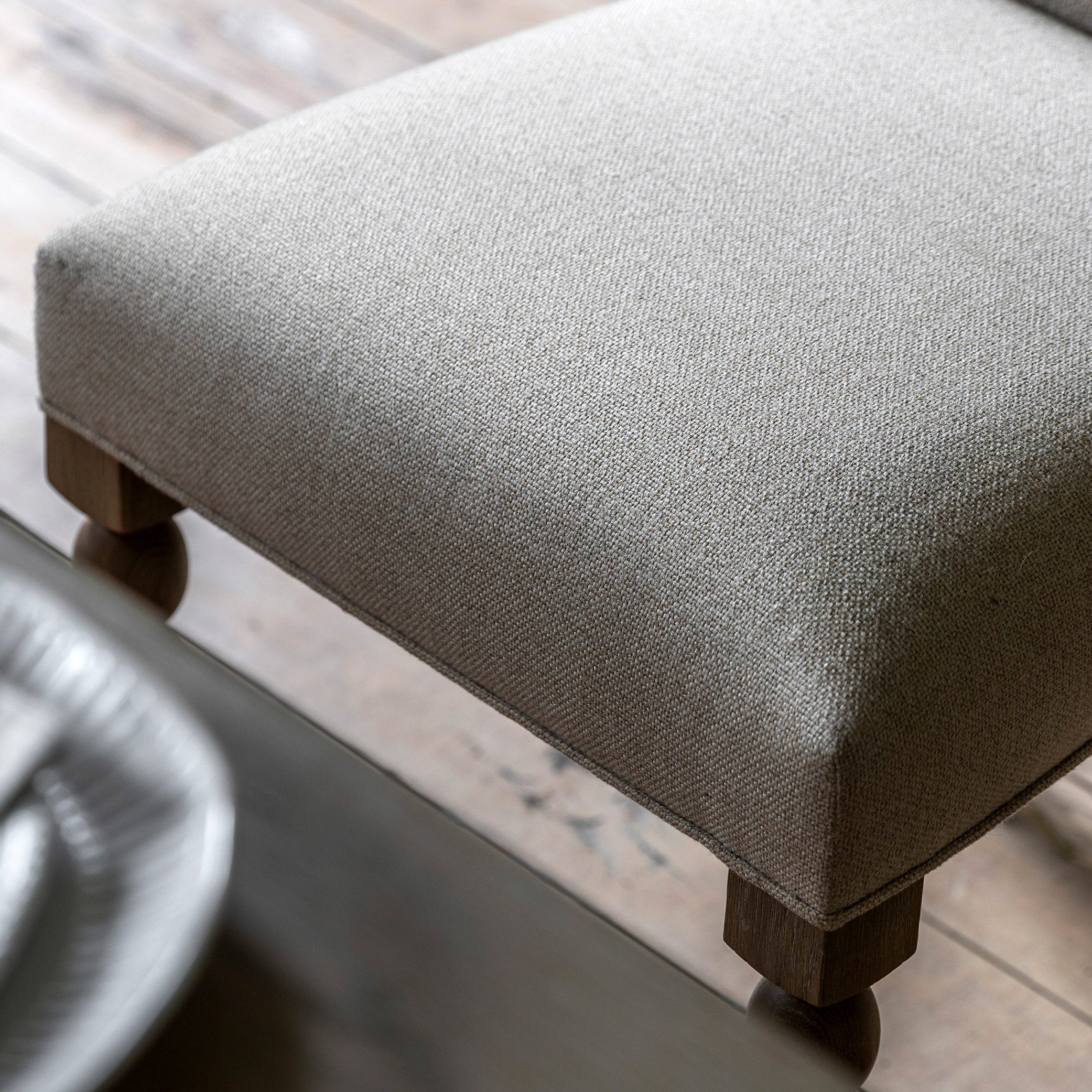 Oak dining chair in lime wash finish, handrafted bobbing detailed legs and upholstered neutral fabric seat