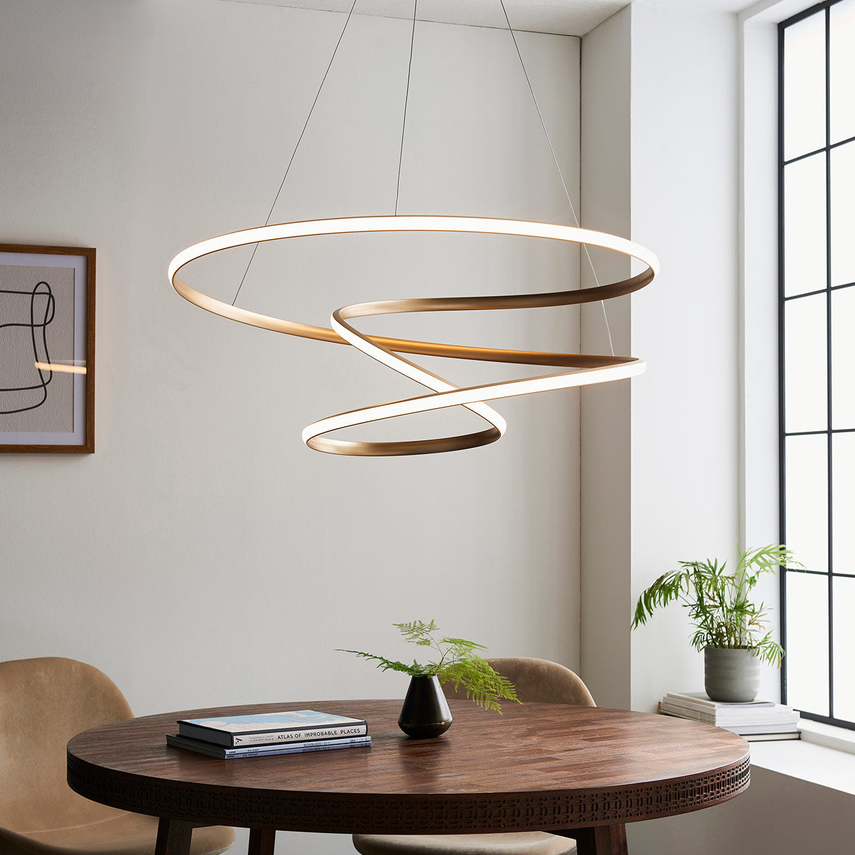 Contemporary gold finished spiral pendant with matt white diffuser
