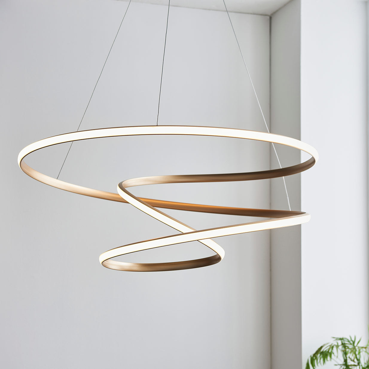 Contemporary gold finished spiral pendant with matt white diffuser