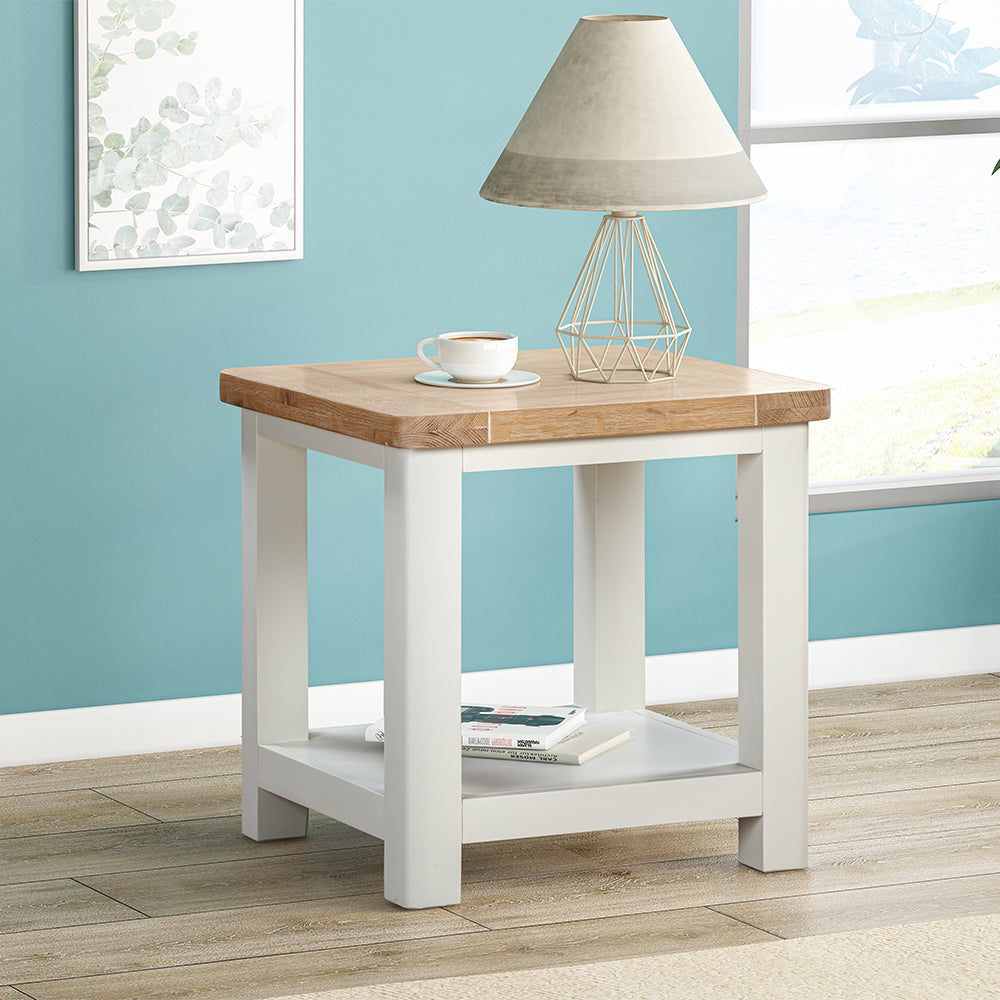 Painted off-white lamp table with natural wood top and lower storage shelf