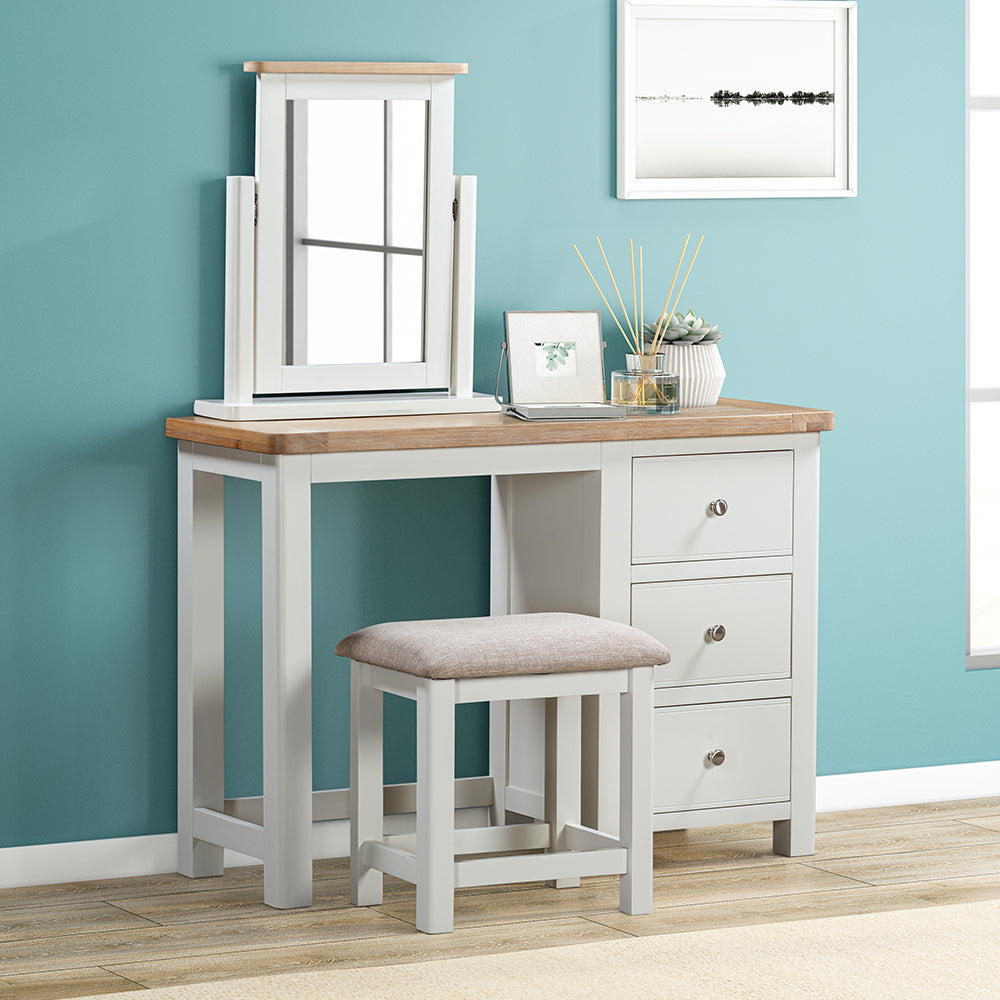 Painted off-white dressing table set with natural wood top, three drawers and matching stool with upholstered seat