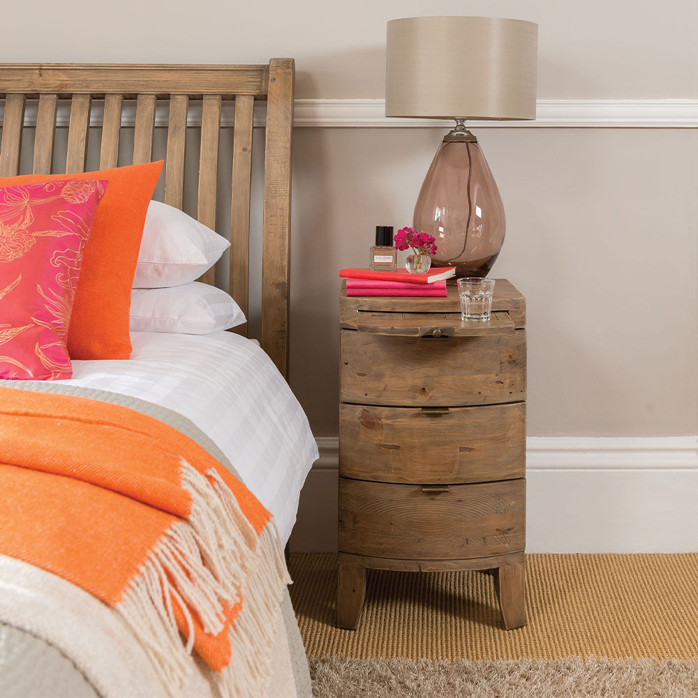 Reclaimed timber wood bedside table in sundried finish with three curved drawers and pull-out desk