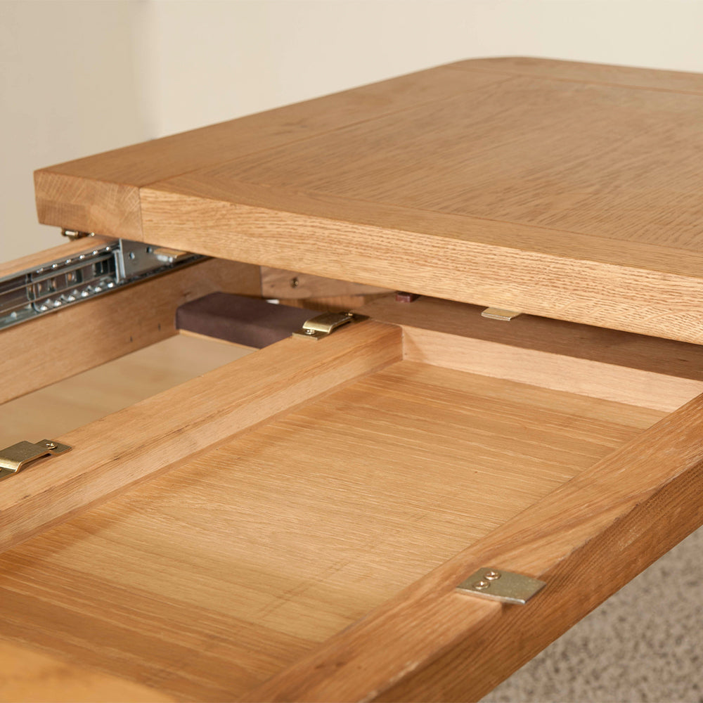 Solid wood extending dining table in natural oak finish