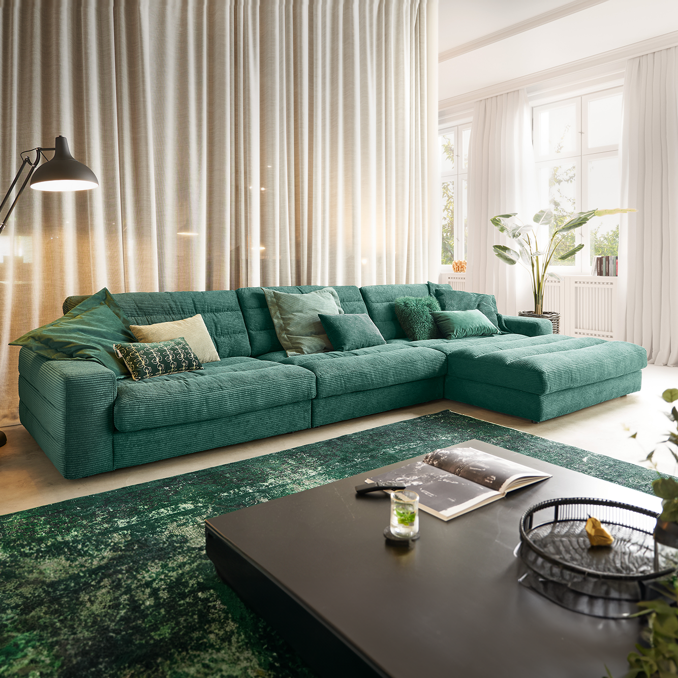 Luxurious corner sofa in dark green textured fabric