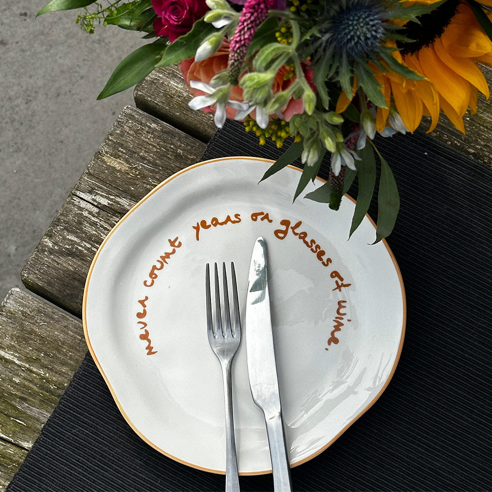 "Never count years or glasses of wine" Orange Decorative Plate