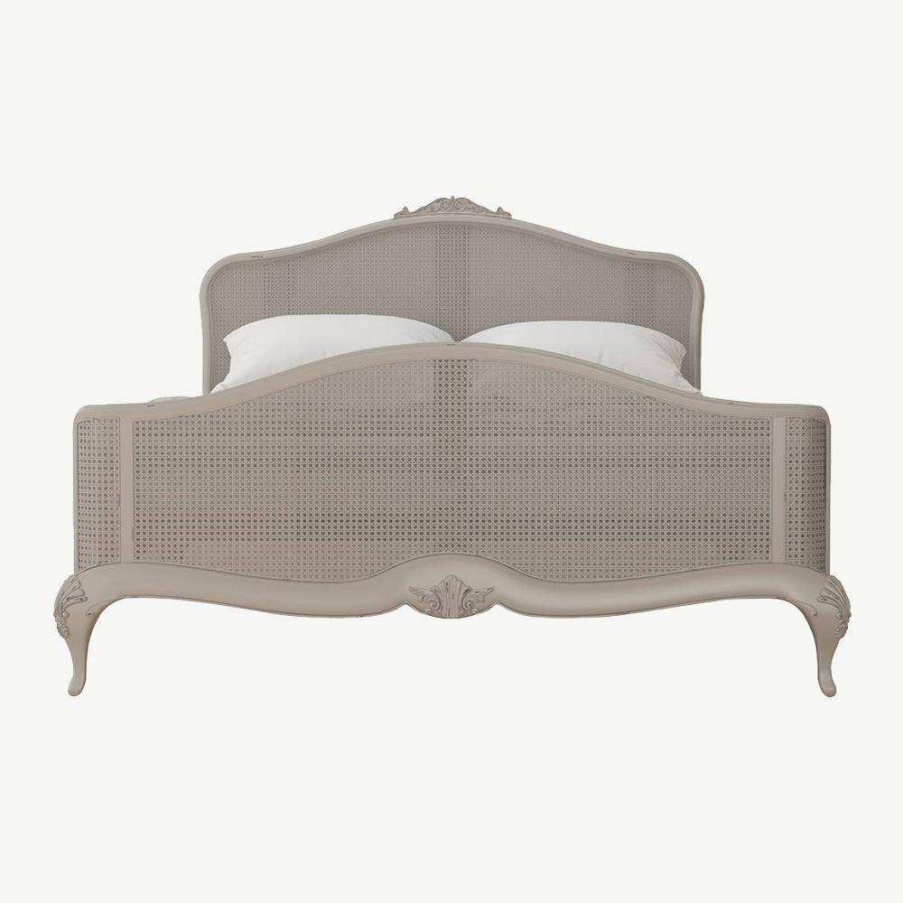 Chic grey rattan bedstead with intricate headboard and footend
