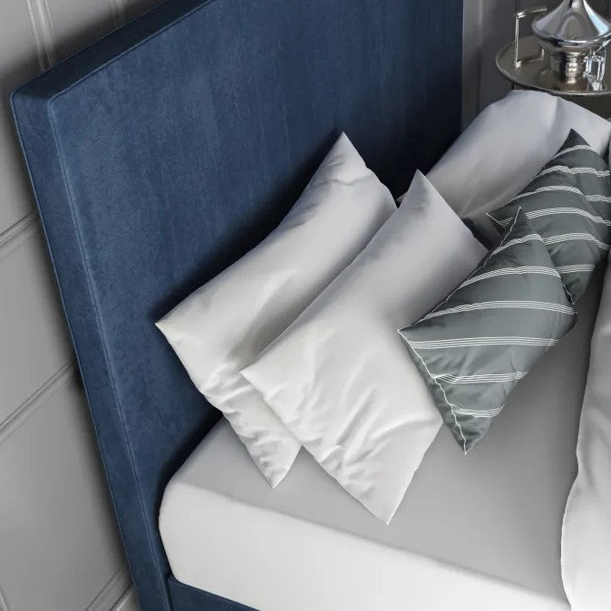 Platform bedframe upholstered in blue fabric