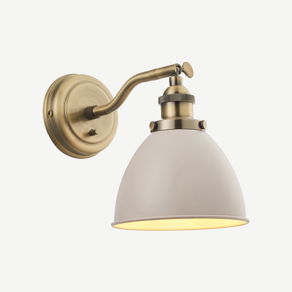 Resto style adjustable wall light, finished in vintage stone colour paint and antiqued brass plated details.