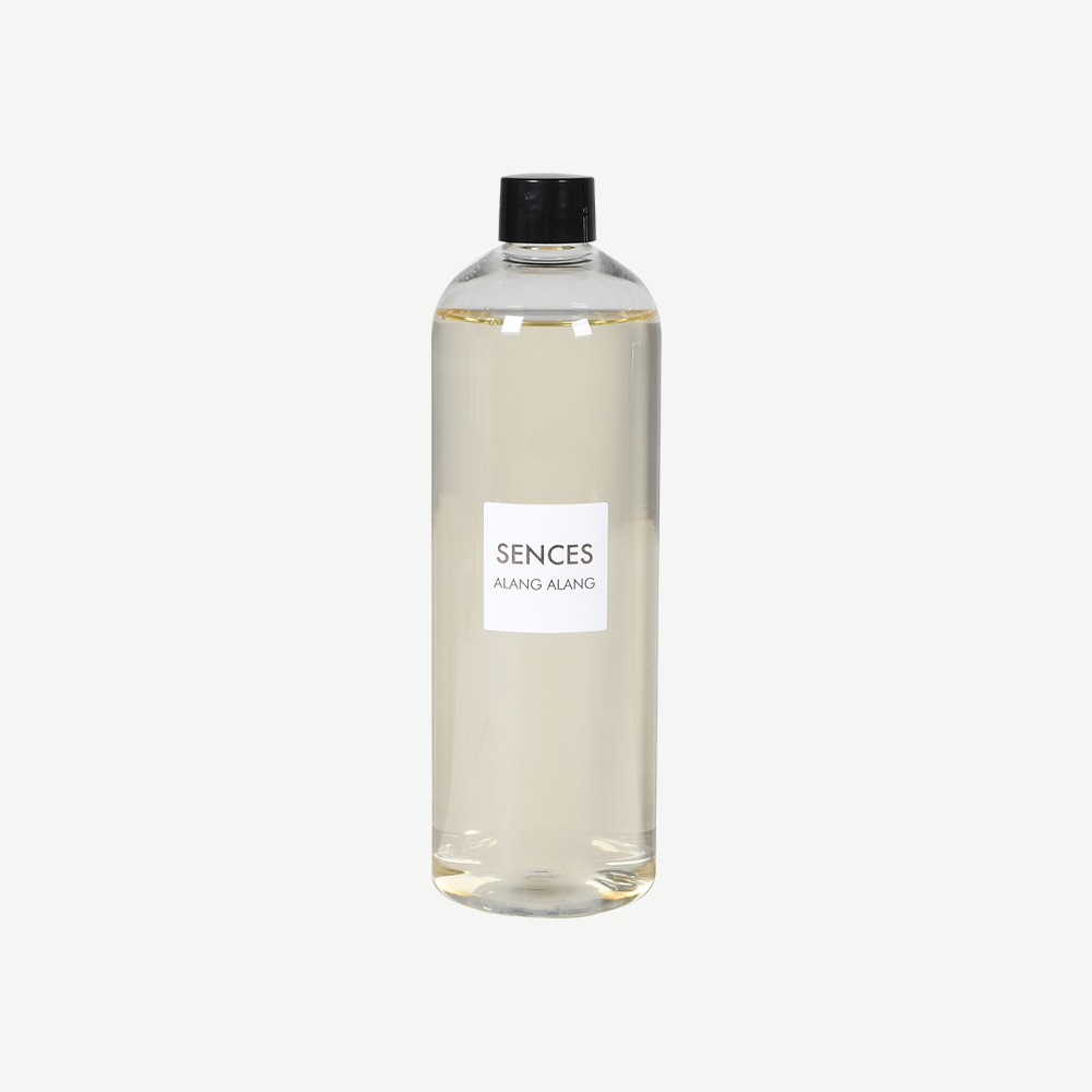 Diffuser refill in clear plastic bottle with black top