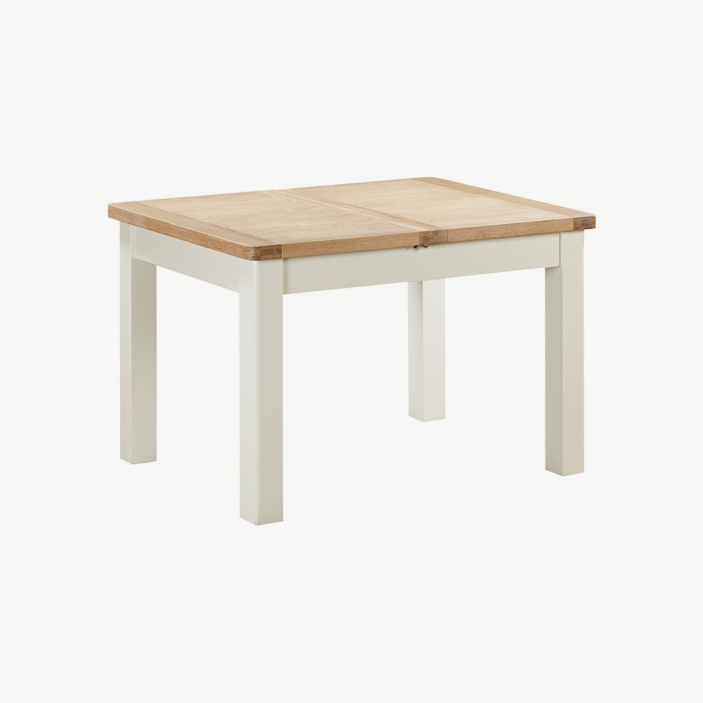 Extending rectangular dining table with natural wood top and painted off-white legs