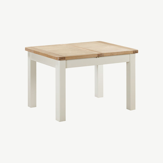 Extending rectangular dining table with natural wood top and painted off-white legs