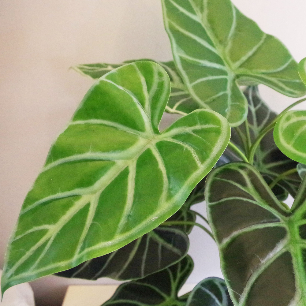 Artificial green fern plant with metal stand and planter