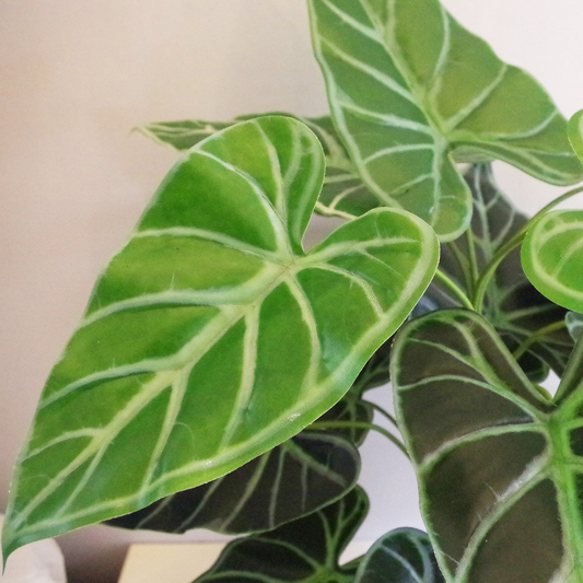 Artificial green fern plant with metal stand and planter