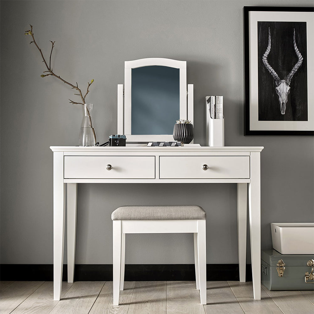 Bedroom stool in painted white upholstered with textured pebble grey fabric

