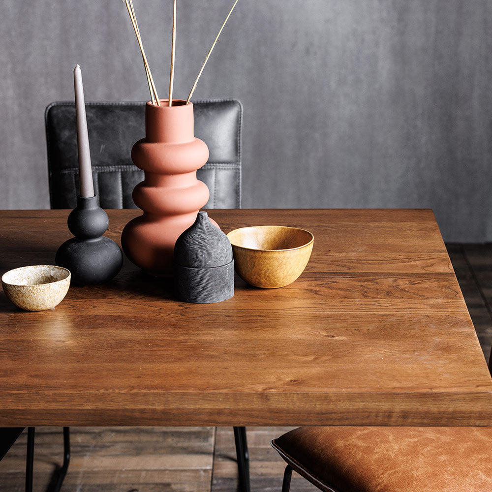 Rustic solid oak dining table with star burst effect black legs
