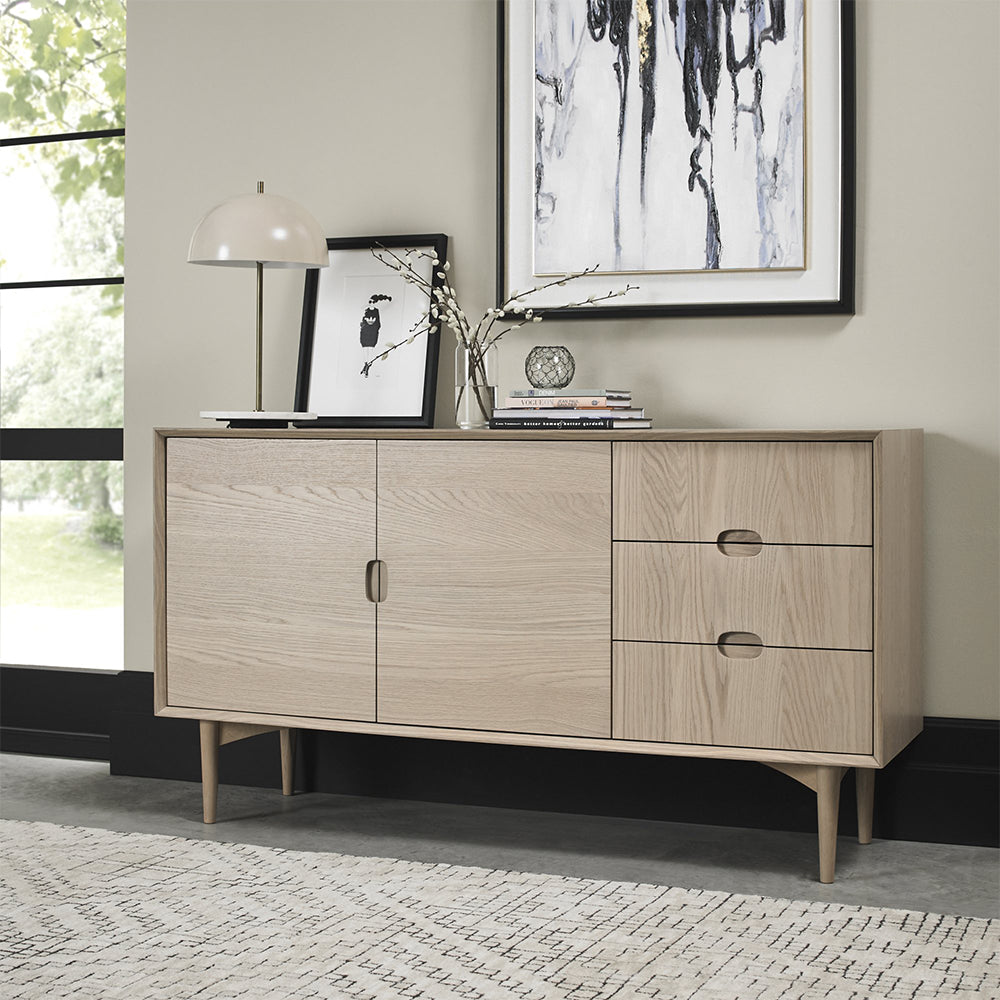 Oak veneer wide sideboard with solid beech legs in light oak finish
