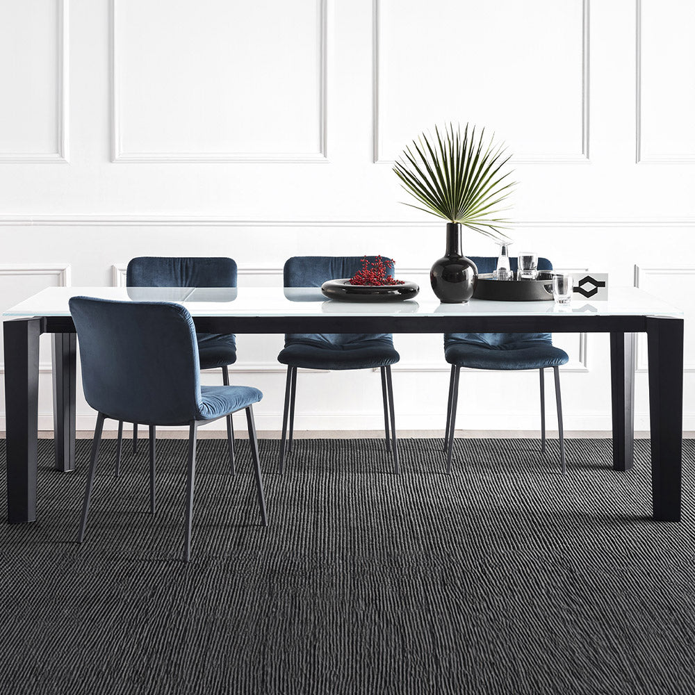 Cement top extending dining table with black legs
