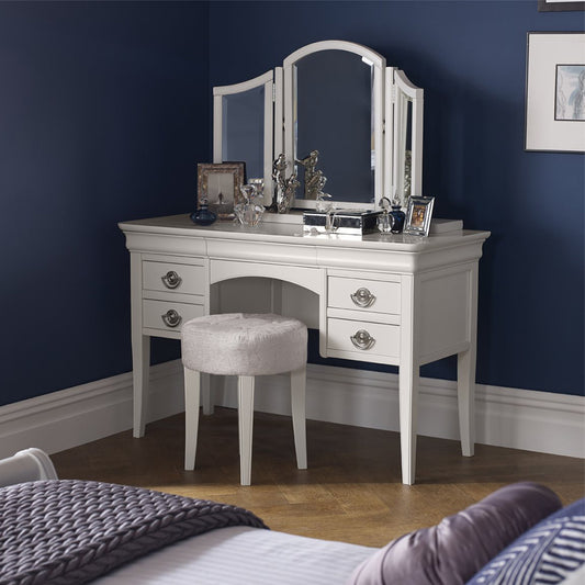 Wooden dressing table in painted white finish with silver handles and four drawers